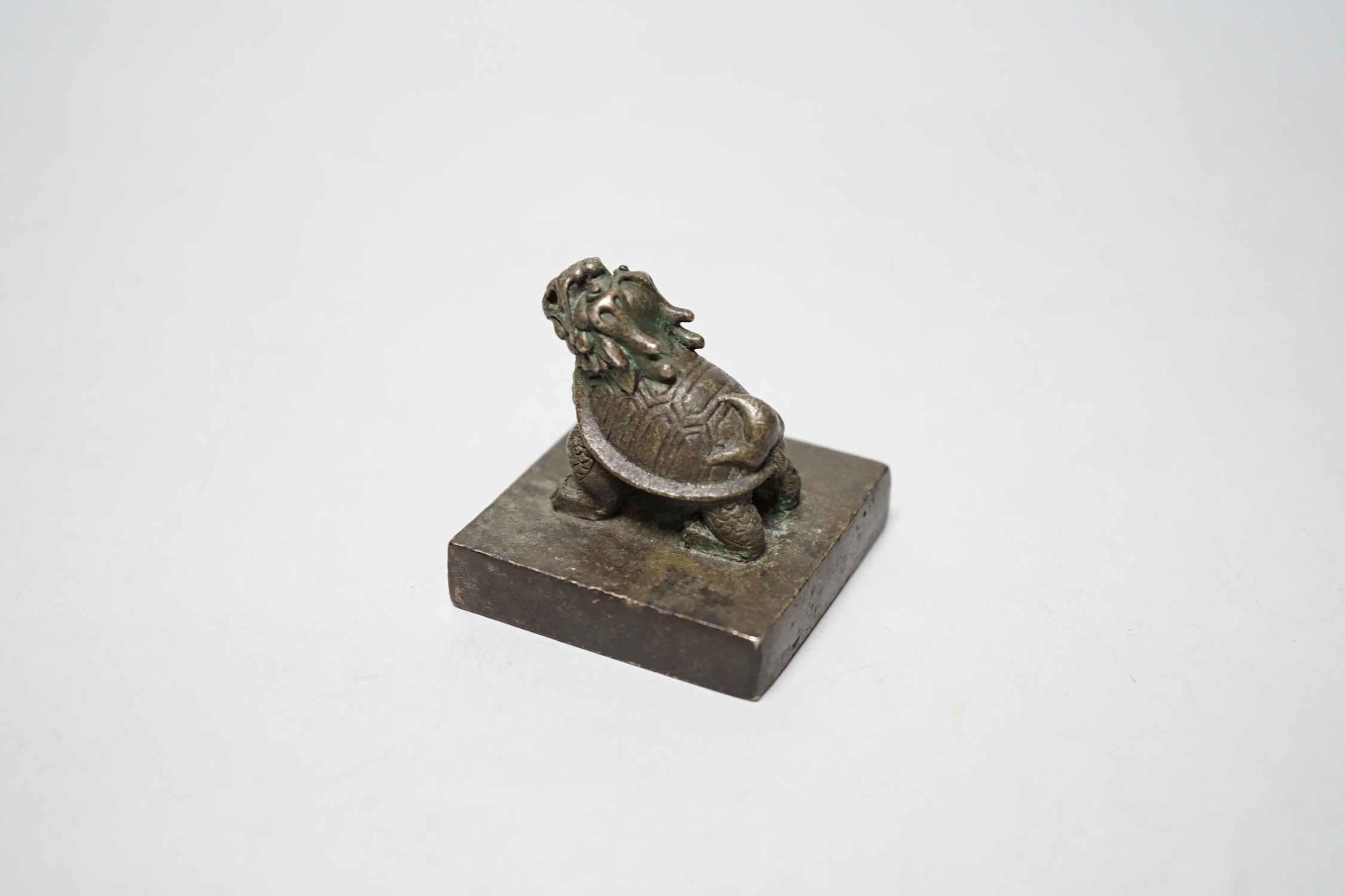 A Chinese bronze ‘Lónggui’ (dragon turtle) seal, 5cm